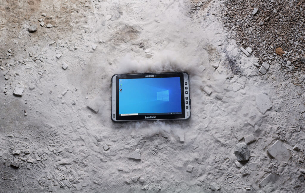 Algiz 10XR Handheld rugged Windows 10 tablet on a very dusty floor